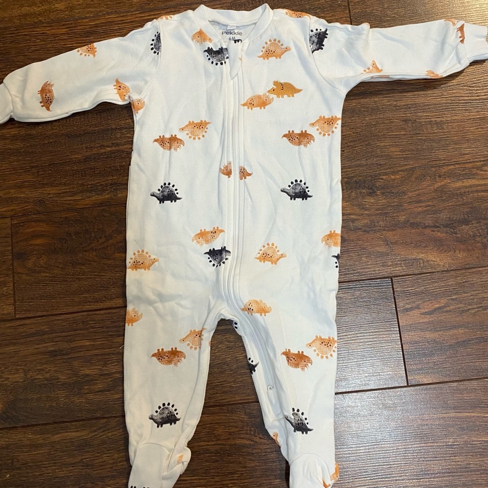 Pekkle's White One Piece with Orange and Black Dinosaur Print